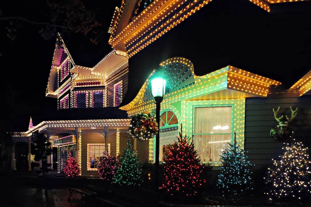 Holiday lights tracing rooflines, windows and building details