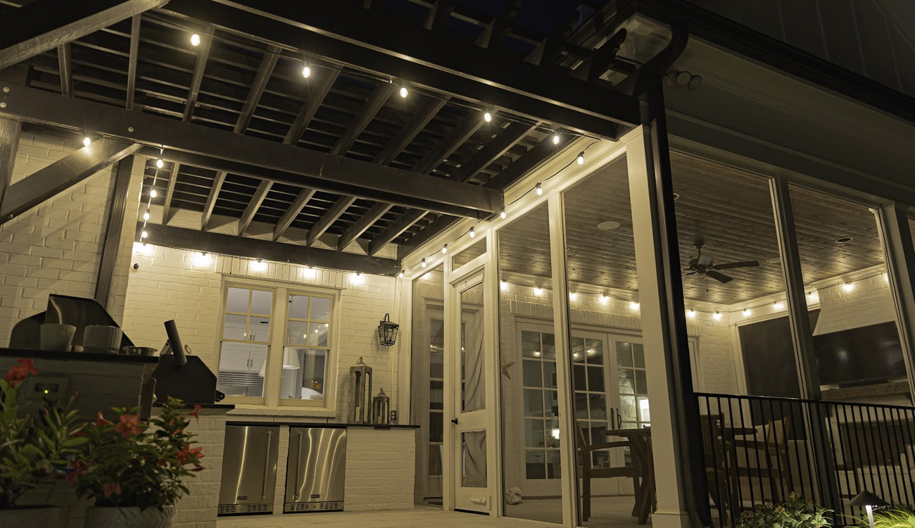 String lights beneath a covered patio roof