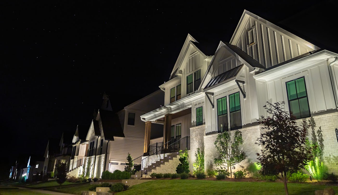 Facade and planting lights along the front of a home