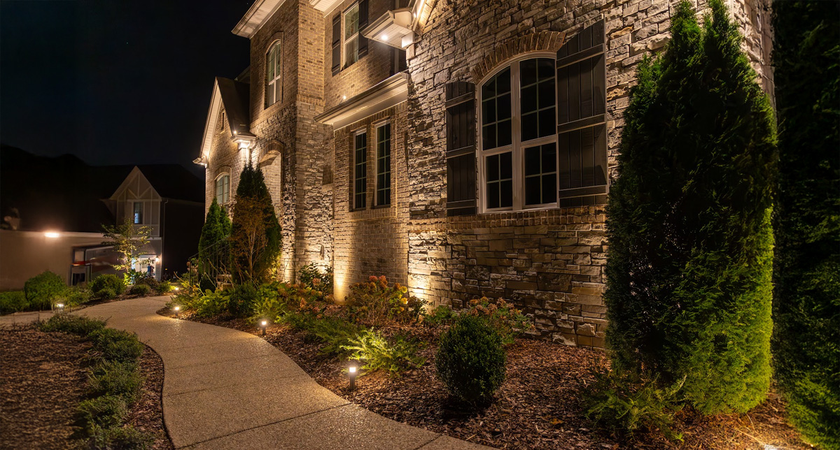What are some features to look for in a security outdoor lighting system?