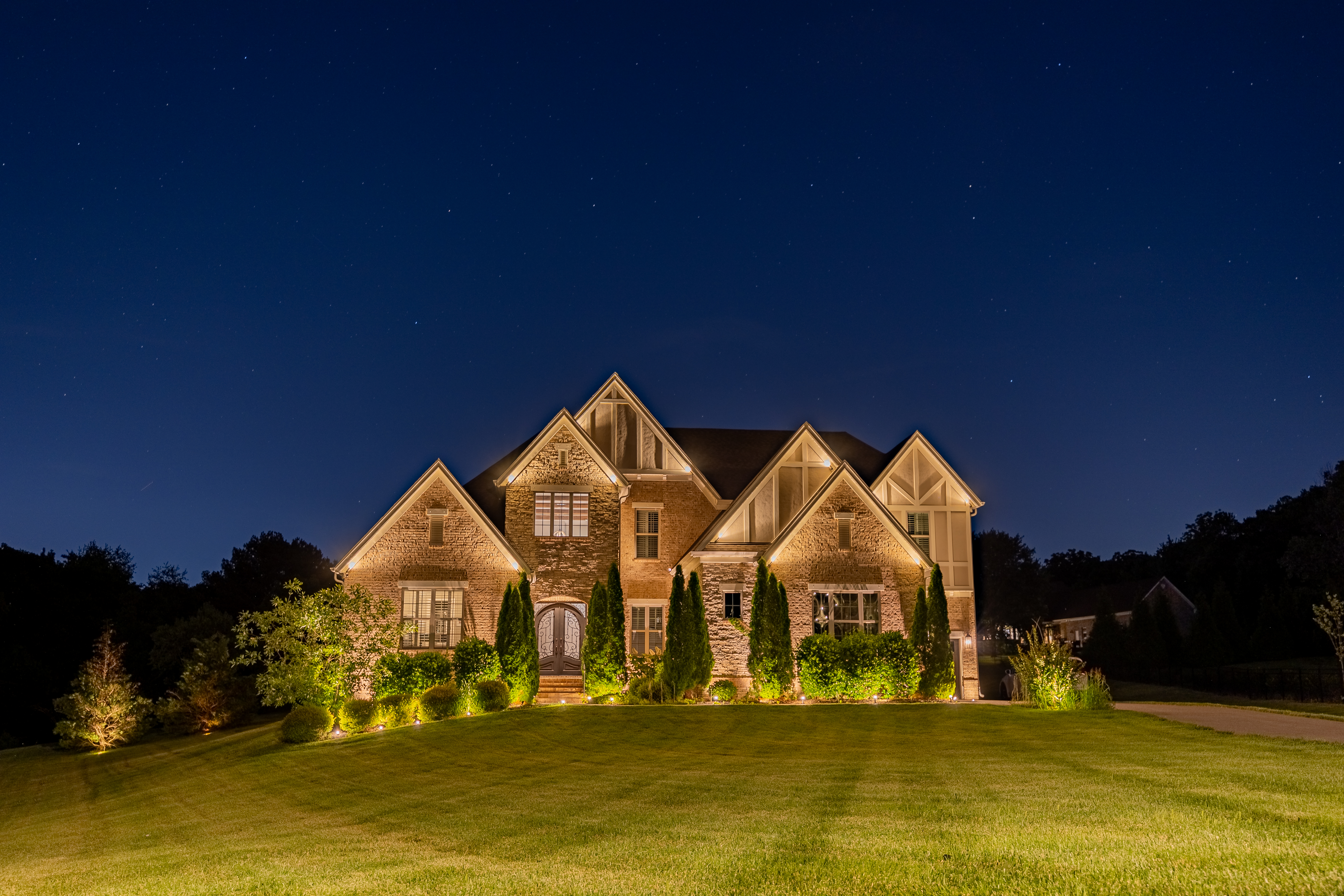 Professionally lit Nashville home at dusk