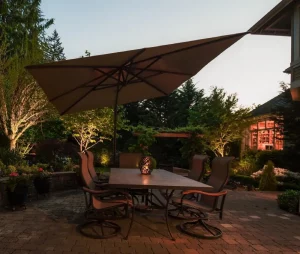 back yard lighting with brown patio furniture